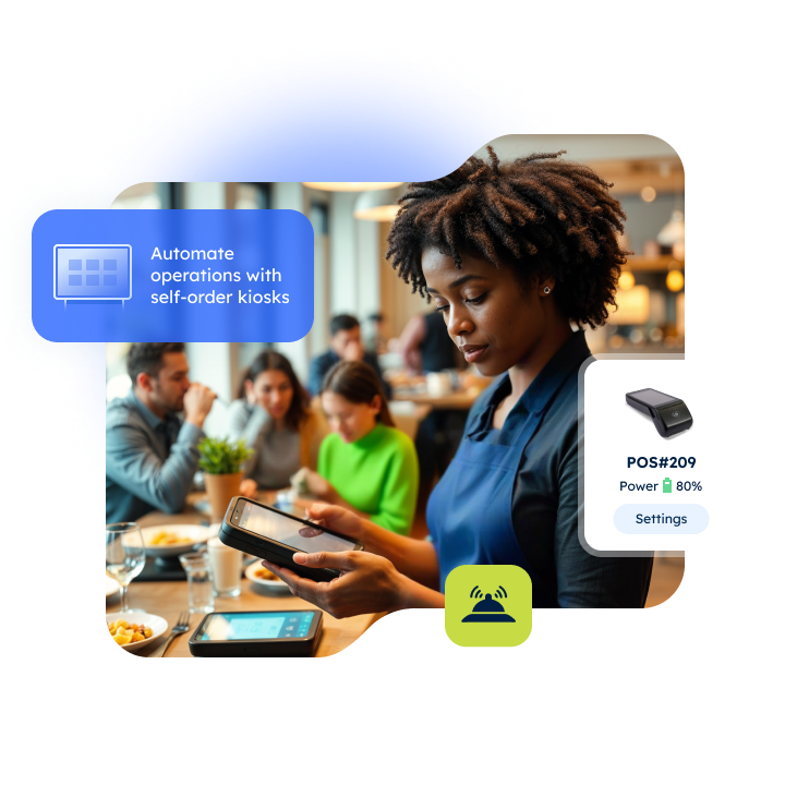 Waitress using tablet in busy restaurant with seated customers.